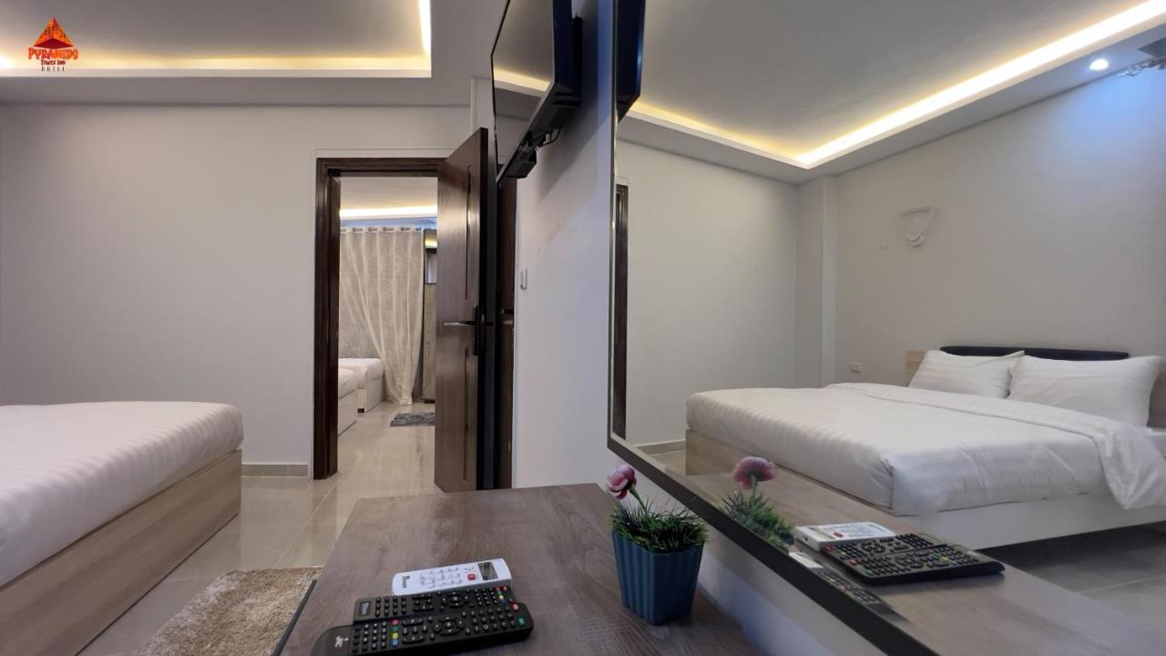 Pyramids Tower View Inn Nazlet el Simman Bagian luar foto