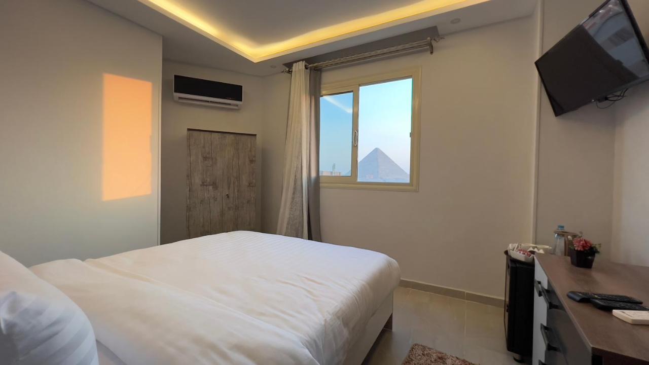 Pyramids Tower View Inn Nazlet el Simman Bagian luar foto